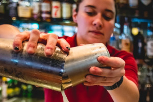 Staff member making cocktail